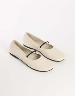 Model wearing Bella leather round toe ballet flat in off white