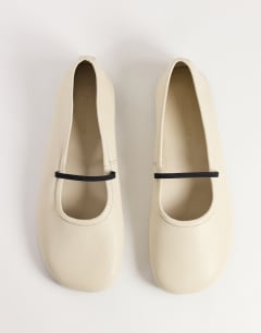 Model wearing Bella leather round toe ballet flat in off white