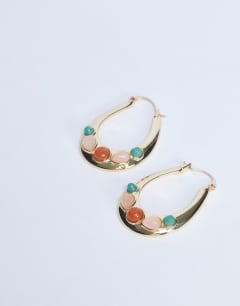 Model wearing Belle hoop earrings with semi-precious stones in gold