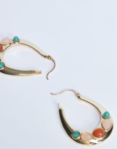 Model wearing Belle hoop earrings with semi-precious stones in gold