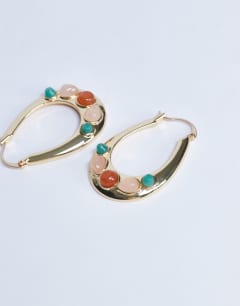 Model wearing Belle hoop earrings with semi-precious stones in gold