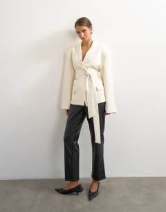Model wearing Belted blazer in ivory