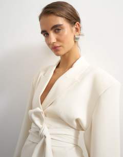 Model wearing Belted blazer in ivory
