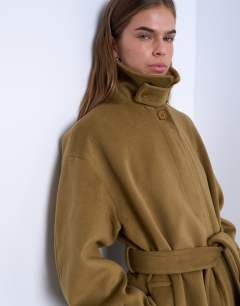 Model wearing Belted longline formal car coat in sage