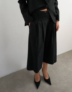 Model wearing Belted pleated cropped wide leg trouser in black
