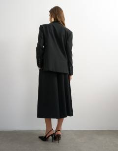 Model wearing Belted pleated cropped wide leg trouser in black