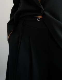 Model wearing Belted pleated cropped wide leg trouser in black