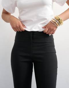 Model wearing Bengaline capri 3/4 length in black