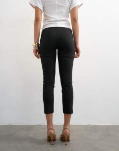 Model wearing Bengaline capri 3/4 length in black