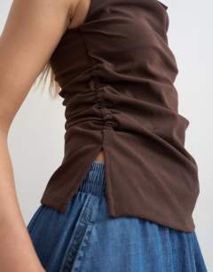 Model wearing Bengaline ruched side slash tank top in chocolate