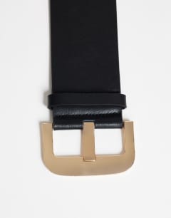 Model wearing Benny wide real leather belt in black