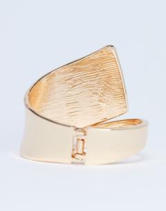 Model wearing Bethany plated bangle in gold
