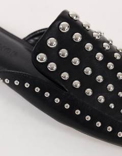 Model wearing Bianca studded flat shoe in black
