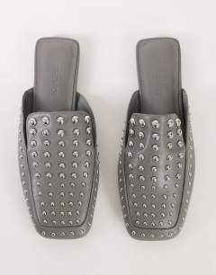 Model wearing Bianca studded flat shoe in grey