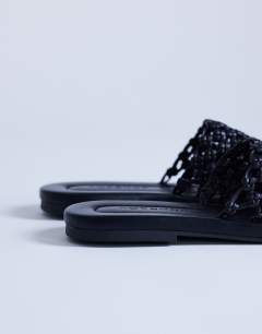 Model wearing Bibi woven mule in black