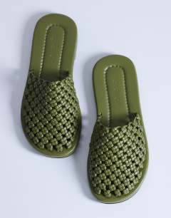 Model wearing Bibi woven mule in olive