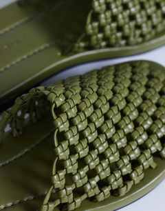 Model wearing Bibi woven mule in olive