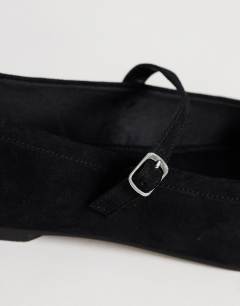 Model wearing Billy real suede ballet flat with buckle in black
