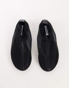 Model wearing Blake mesh ballet flat shoe in black