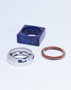 Model wearing Blanks 3 pack bangles in wood, silver & blue