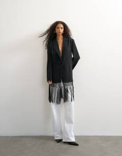 Model wearing Blazer with fringe detail in black