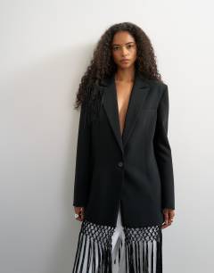 Model wearing Blazer with fringe detail in black
