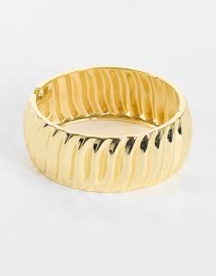 Model wearing Blossom chunky bangle in gold