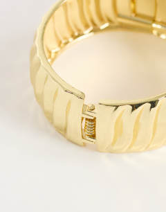 Model wearing Blossom chunky bangle in gold