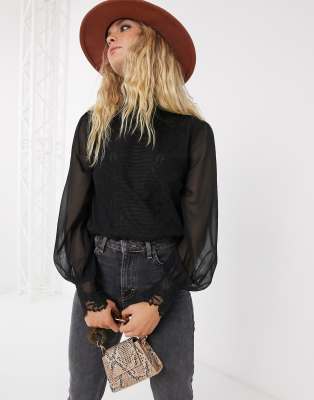 black blouse with sheer sleeves