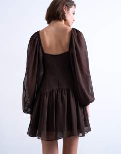 Model wearing Blouson sleeve mini tea dress in chocolate brown