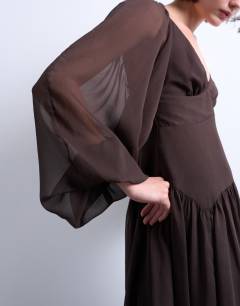 Model wearing Blouson sleeve mini tea dress in chocolate brown