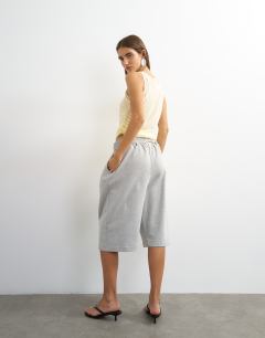 Model wearing Board shorts in grey marl