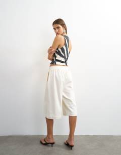Model wearing Board shorts in ivory