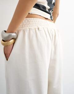 Model wearing Board shorts in ivory