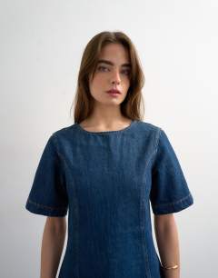 Model wearing Boat neck structured sleeve mini dress in mid blue