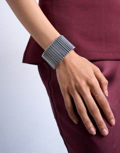 Model wearing Bobbi bangle in silver