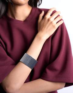 Model wearing Bobbi bangle in silver