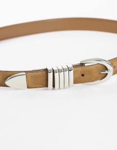 Model wearing Bobbi suedette multi keeper belt in sand