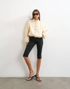 Model wearing Bomber mandarin collar jacket in ecru