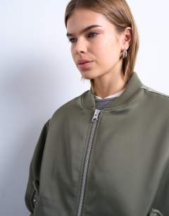 Model wearing Bomber with contrast lining in green 
