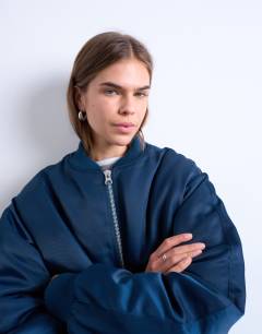 Model wearing Bomber with contrast lining in navy