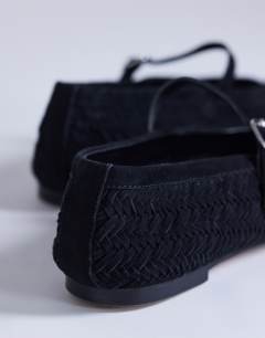 Model wearing Bonnie real suede woven ballet in black