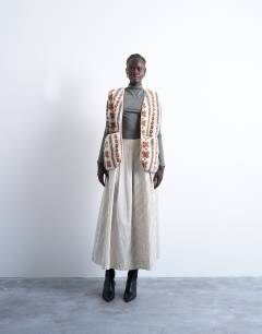 Model wearing Borg abstract printed gilet in multi