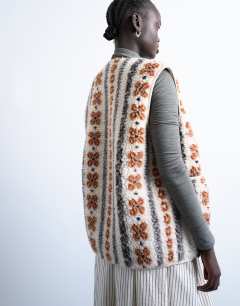 Model wearing Borg abstract printed gilet in multi