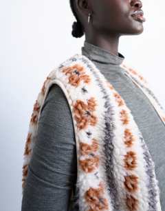Model wearing Borg abstract printed gilet in multi