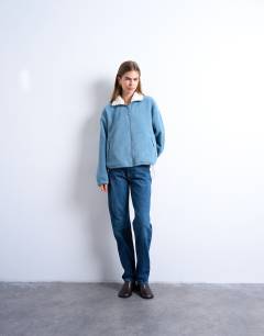 Model wearing Borg fleece funnel zip through in blue