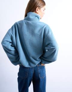 Model wearing Borg fleece funnel zip through in blue