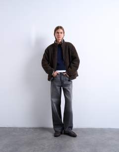 Model wearing Borg fleece jacket with contrast piping in brown