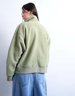 Model wearing Borg funnel zip through in green