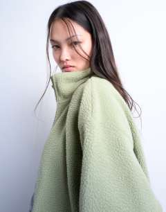 Model wearing Borg funnel zip through in green